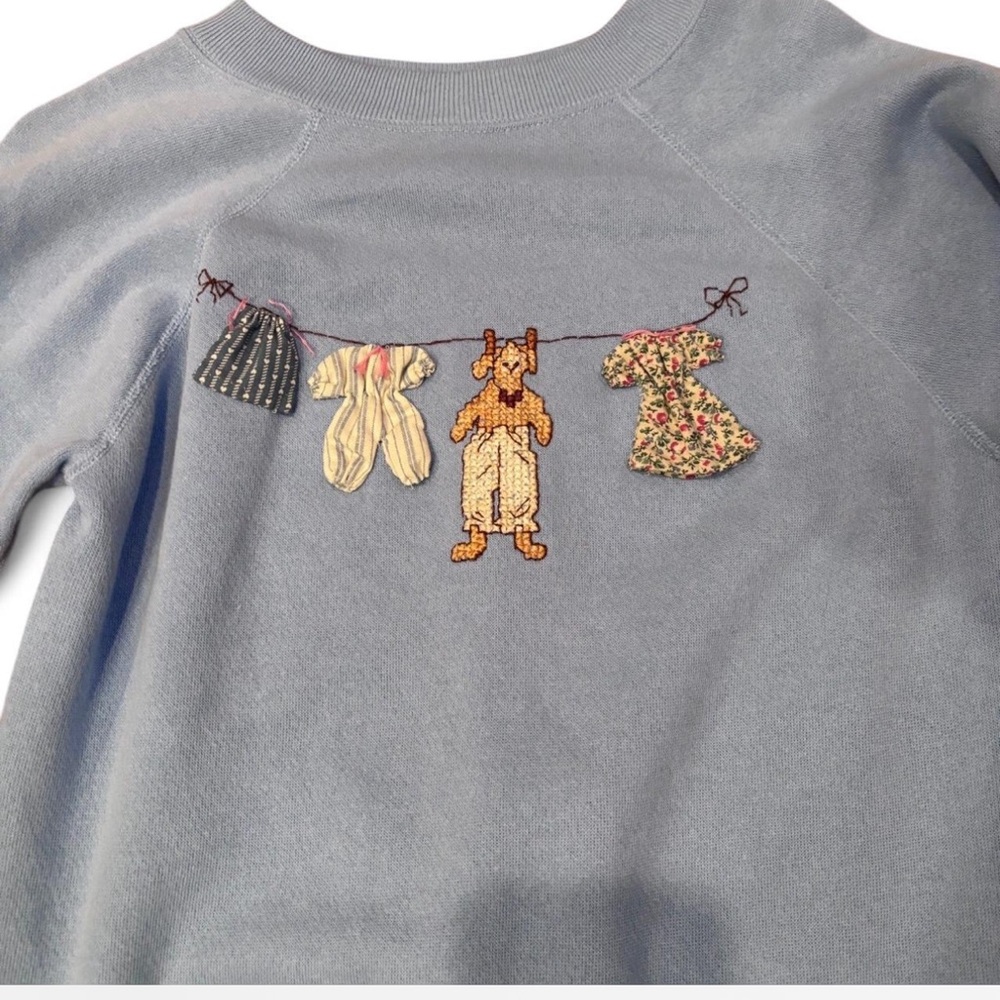 Blue Sweatshirt with Embroidered Clothesline Design - Picture 2 of 3